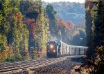 CSX 3437 leads westbound empty auto racks descending Washington Hill